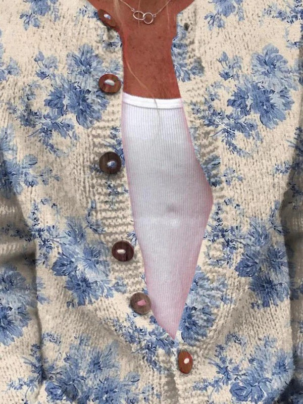 Cardigan con fiori blu e bottoni effetto tartaruga